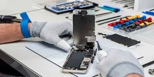 Technician repairing a phone at Zain Mobile Solution